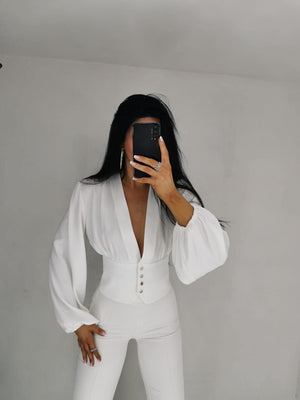Agatha Pucci Statement Blouse With Corset Hem and Deep Neckline